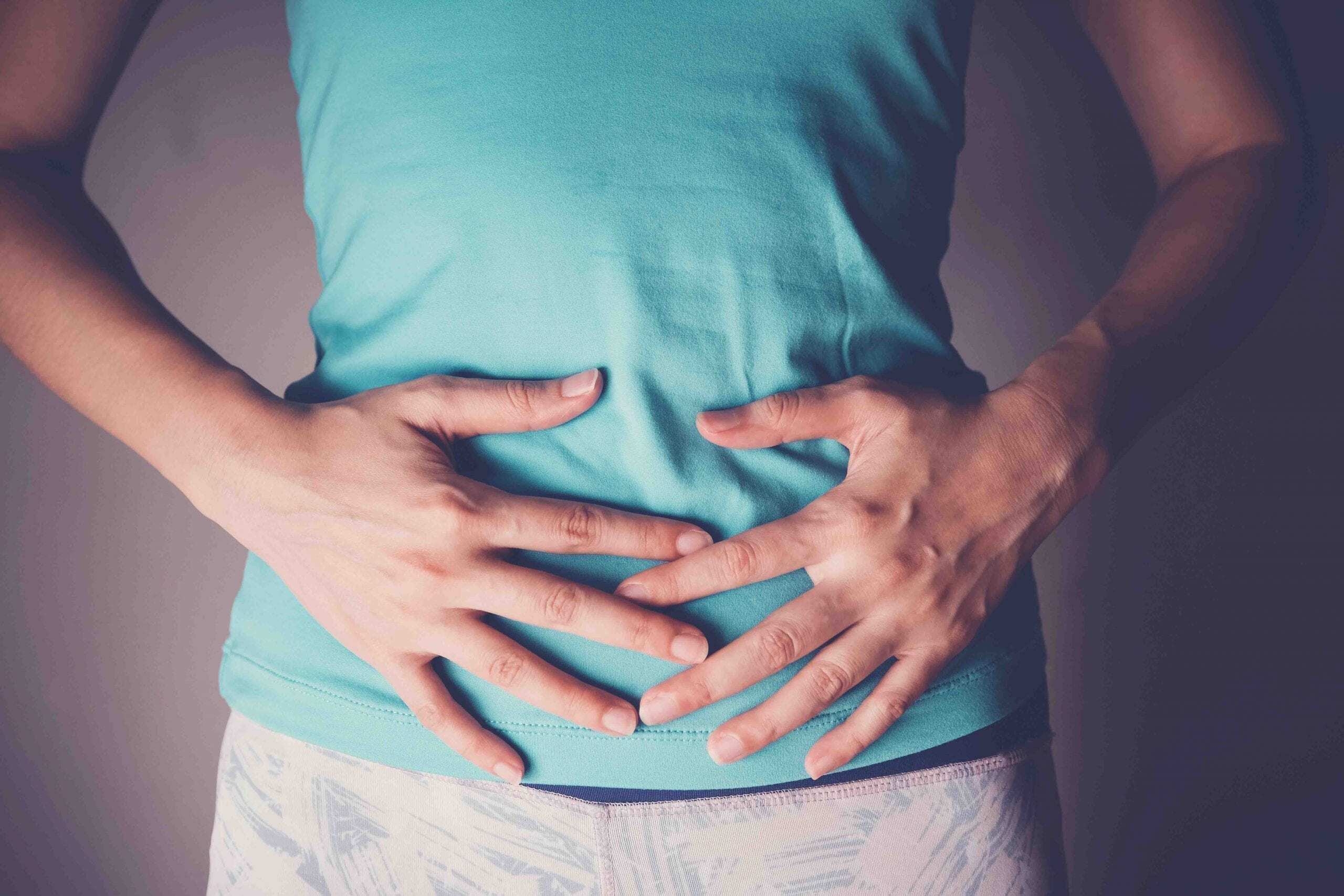 woman hands on her stomach, probiotics food for gut health, having stomachache