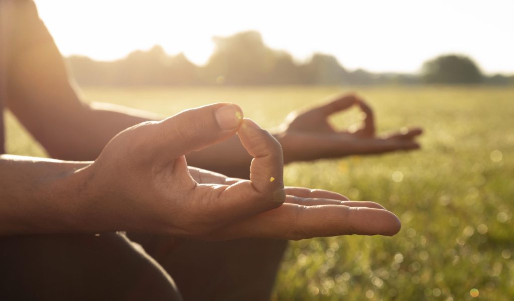 side-view-man-meditating-outdoors